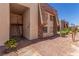 Exterior view of an apartment featuring convenient staircase access and desert landscaping at 5301 River Glen Dr # 205, Las Vegas, NV 89103