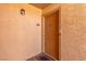 Exterior view of a front door including door hardware and a welcome mat at 5301 River Glen Dr # 205, Las Vegas, NV 89103