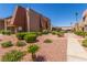 Manicured grounds, with bushes and palm trees are nicely kept at 5301 River Glen Dr # 205, Las Vegas, NV 89103