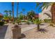 A shady community space with palm trees and picnic tables for relaxing at 5301 River Glen Dr # 205, Las Vegas, NV 89103