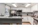 Kitchen with modern appliances and stone countertops at 5301 River Glen Dr # 205, Las Vegas, NV 89103