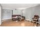 A large living room area with wood floors, neutral colors, and ample space at 5301 River Glen Dr # 205, Las Vegas, NV 89103
