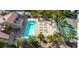 Community pool and lounge area with ample seating, gazebos, and tennis courts, perfect for relaxing and recreation at 5301 River Glen Dr # 205, Las Vegas, NV 89103