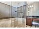 Bathroom with glass shower, decorative tile, and a vanity with dark wood cabinets at 5367 Secluded Brook Ct, Las Vegas, NV 89149