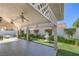 Charming covered patio with ceiling fans and a view of the landscaped yard at 5425 Thomaston Ct, Las Vegas, NV 89122