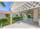 Inviting covered patio with lattice details overlooks a serene landscaped yard at 5425 Thomaston Ct, Las Vegas, NV 89122