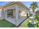 Relaxing covered patio overlooks lush greenery and a decorative fountain at 5425 Thomaston Ct, Las Vegas, NV 89122