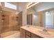 Double vanity bathroom with tile shower and glass enclosure at 5425 Thomaston Ct, Las Vegas, NV 89122