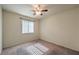 Neutral bedroom featuring carpet, a ceiling fan and one window for natural light at 5425 Thomaston Ct, Las Vegas, NV 89122