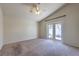 Bedroom with ceiling fan and sliding glass doors for natural light at 5425 Thomaston Ct, Las Vegas, NV 89122