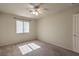 A bright bedroom featuring a ceiling fan and natural light at 5425 Thomaston Ct, Las Vegas, NV 89122