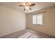Carpeted bedroom with ceiling fan and one window at 5425 Thomaston Ct, Las Vegas, NV 89122