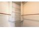 Open closet with wire shelving and wood hanging rods at 5425 Thomaston Ct, Las Vegas, NV 89122