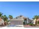 Charming single-story home with a tile roof, arched entryway, and a well-maintained front yard at 5425 Thomaston Ct, Las Vegas, NV 89122
