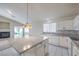 Bright kitchen featuring a large island, fireplace and modern appliances at 5425 Thomaston Ct, Las Vegas, NV 89122