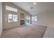 Bright living room with fireplace, large windows, and sliding doors to the outdoor space at 5425 Thomaston Ct, Las Vegas, NV 89122