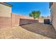 Backyard features rock landscaping and a privacy wall, offering a tranquil outdoor space at 582 Brompton St, Las Vegas, NV 89178