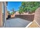 Enclosed backyard features a concrete patio, rock landscaping, and privacy wall at 582 Brompton St, Las Vegas, NV 89178