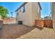 Backyard with rock landscaping, a concrete patio, and a brick privacy wall at 582 Brompton St, Las Vegas, NV 89178
