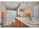 Bathroom with double sinks, and shower-tub combo provides efficient functionality at 582 Brompton St, Las Vegas, NV 89178
