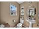 Well-lit half bathroom with modern fixtures and charming decor at 582 Brompton St, Las Vegas, NV 89178