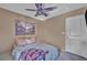 Bedroom featuring a bed, neutral walls, and a patterned ceiling fan at 582 Brompton St, Las Vegas, NV 89178