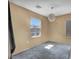 Bright bedroom with a modern light fixture and gray carpet at 582 Brompton St, Las Vegas, NV 89178
