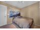 Bedroom featuring neutral walls, carpet flooring, and modern artwork at 582 Brompton St, Las Vegas, NV 89178