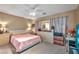 Spacious bedroom with a ceiling fan and well-lit with neutral color scheme at 582 Brompton St, Las Vegas, NV 89178