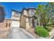 Two-story home boasts an attached garage and easy-to-maintain desert landscaping at 582 Brompton St, Las Vegas, NV 89178