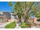 Charming two-story home featuring a well-manicured front yard with mature landscaping at 582 Brompton St, Las Vegas, NV 89178