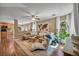 Open-concept living room showcasing stylish furnishings and warm hardwood flooring at 582 Brompton St, Las Vegas, NV 89178