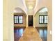 Inviting foyer with high ceilings, arched doorways and elegant tile flooring at 585 Via Alhambra, Las Vegas, NV 89123