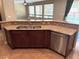 Kitchen island featuring stainless steel appliances, undermount sink and granite countertop at 585 Via Alhambra, Las Vegas, NV 89123