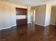 Spacious living room with hardwood floors and a built-in cabinet at 585 Via Alhambra, Las Vegas, NV 89123