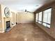 Spacious living room with travertine flooring, fireplace, and natural light at 585 Via Alhambra, Las Vegas, NV 89123