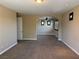 Open living space with carpet flooring, recessed lighting and an arched doorway at 585 Via Alhambra, Las Vegas, NV 89123