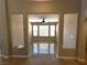 Open living area with light-filled windows and neutral-toned walls at 585 Via Alhambra, Las Vegas, NV 89123