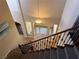 Elegant carpeted staircase with wrought iron railings and arched entryways at 585 Via Alhambra, Las Vegas, NV 89123