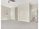 Spacious bedroom with neutral carpeting and multiple entryways for easy access at 5908 Big Horn View St, North Las Vegas, NV 89031