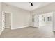 Bright bedroom with wood-style flooring, neutral walls, and multiple doorways at 5908 Big Horn View St, North Las Vegas, NV 89031