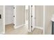 Hallway leading to walk in closet and featuring light wood floors at 5908 Big Horn View St, North Las Vegas, NV 89031