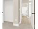 Hallway with white doors leading into bathroom at 5908 Big Horn View St, North Las Vegas, NV 89031