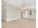 Spacious living room with light-colored wood floors and modern lighting fixtures at 5908 Big Horn View St, North Las Vegas, NV 89031