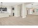 Open-concept living area with light-colored floors, large windows, and modern finishes at 5908 Big Horn View St, North Las Vegas, NV 89031