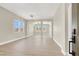 Open-concept living room featuring light-colored walls, flooring, and ample natural light at 5908 Big Horn View St, North Las Vegas, NV 89031