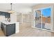Open-concept living space connecting kitchen, living, and outdoor patio at 5908 Big Horn View St, North Las Vegas, NV 89031