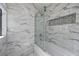 Upgraded bathroom featuring marble tile and glass shower doors at 6109 W Oakey Blvd # C, Las Vegas, NV 89146