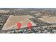 Aerial view of neighborhood shows the home's proximity to other residences and the surrounding landscape at 6370 Ava Ridge Ave, Las Vegas, NV 89141