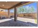 Shaded patio area with brick pavers, bench seating and a view of the backyard landscaping at 6370 Ava Ridge Ave, Las Vegas, NV 89141